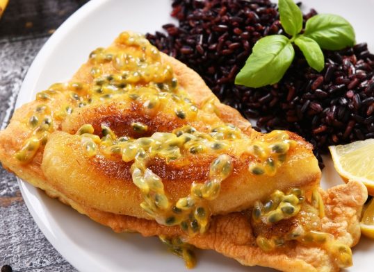 Traditional madeira dish - scabbardfish with bananas and passion fruit
