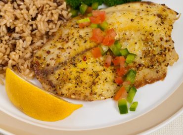 Tilapia Fish with Broccoli and Brown Rice. Selective focus.