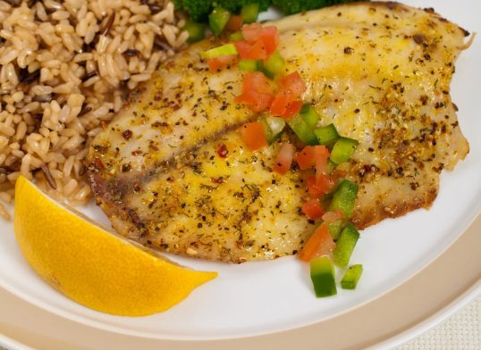 Tilapia Fish with Broccoli and Brown Rice. Selective focus.
