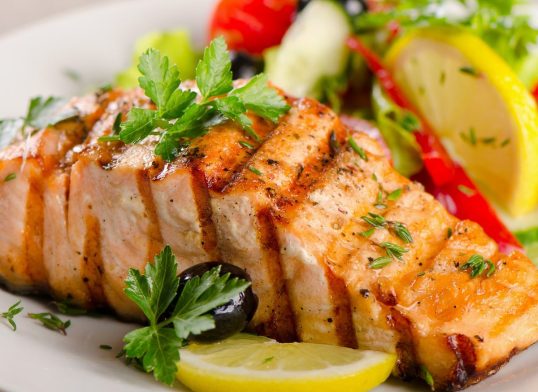 Salmon with  fresh salad.