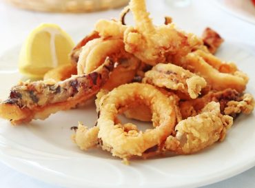 plate with squid at a greek tavern - mediterranean seafood