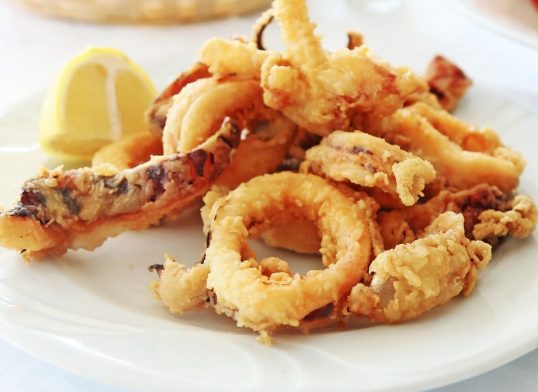 plate with squid at a greek tavern - mediterranean seafood