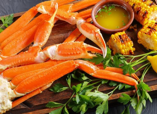 Crab legs, grilled corn in cobs