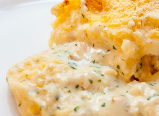 Close-up of a fish pie on a white plate
